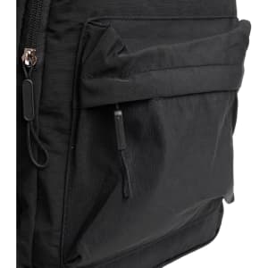 A black backpack with a front pocket and zipper details, featuring a simple, functional design and a logo.