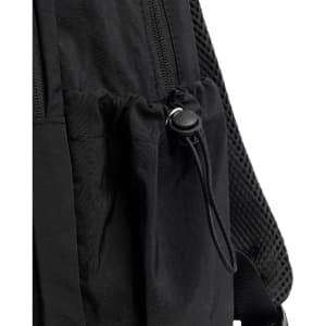 A close-up of a black backpack featuring a drawstring pocket and textured straps. The backpack has a logo.