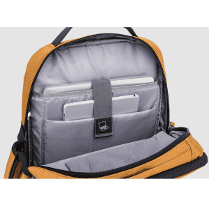 An open golden-yellow backpack displaying a grey interior with compartments for laptops and tablets, featuring a logo.