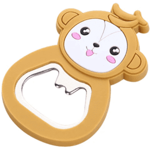 A drink bottle opener shaped like a brown monkey with a smiling face and a shiny bottle opening section.