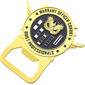A gold metal bottle opener shaped like a badge, featuring an eagle emblem and a logo.