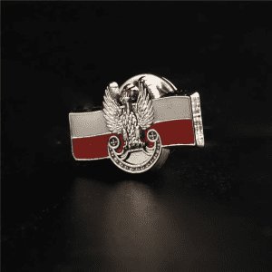A custom enamel lapel pin featuring a design with red and white colours and a winged emblem.