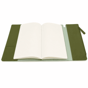 An olive green soft-touch PU leather notebook with a zipper pocket and open lined pages.