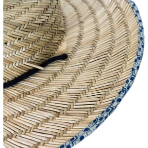 A straw hat with a wide brim, featuring natural straw colours and a blue patterned edge, along with a black strap.