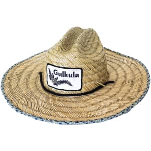 A straw hat in natural tones, featuring a wide brim and a central logo patch.