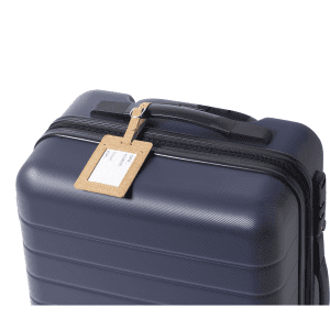 A navy suitcase with a cork luggage tag attached to the handle, featuring a minimalist design.