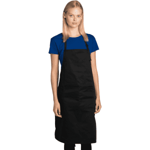 A black chef's apron worn by a model, paired with a blue T-shirt. The apron features a logo.