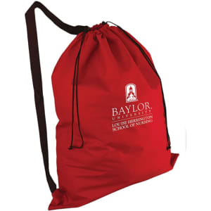 A red non-woven laundry duffel bag with an over-the-shoulder strap and a logo.