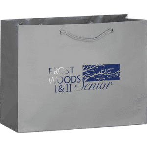 A grey tote bag with a logo and a rope handle, featuring a minimalist design and spacious interior.
