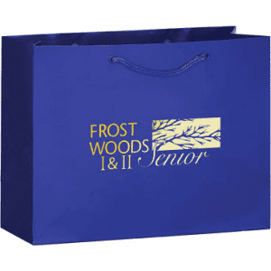 A blue tote bag with a logo displayed prominently on the front, featuring a design element.