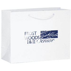 A white tote bag with a logo and text in navy blue. It features carry handles for easy transport.