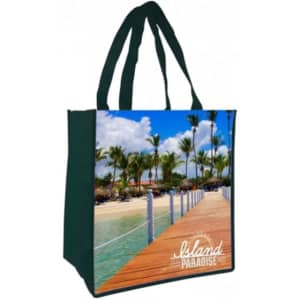 A green tote bag featuring a scenic beach design with palm trees and a wooden boardwalk, including a logo.