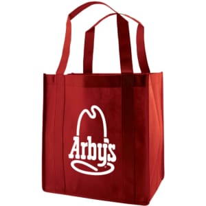 A large red reusable grocery bag with sturdy handles and a logo on the front.
