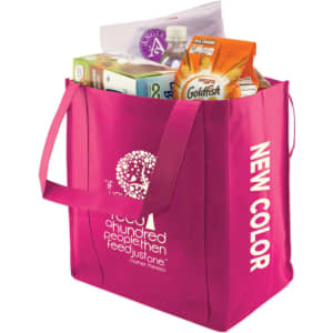 A pink extra large non-woven shopping bag filled with various grocery items and featuring a logo.