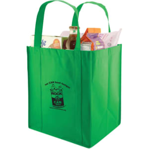 A green extra large non-woven shopping bag with two handles, filled with various grocery items and featuring a logo.