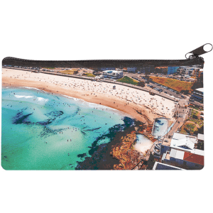 A large neoprene pencil case featuring a vibrant coastal scene with shades of blue and sandy beach. It has a zippered closure.