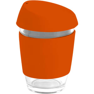 A reusable glass coffee cup with an orange silicone lid and band, featuring a transparent body and stainless steel band.