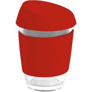 A reusable glass coffee cup with a red silicone lid and band, featuring a transparent glass body.