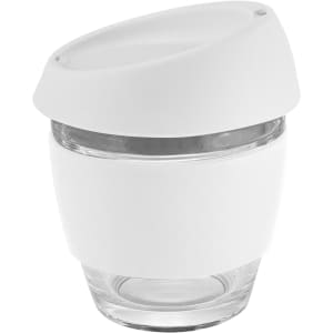 A coffee cup made of glass, featuring a white silicone lid and band, with a clear glass base.