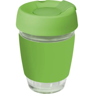 A green reusable coffee cup with a silicone lid and band, featuring a clear glass body and a logo.