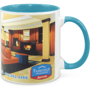 A two-tone sublimation mug featuring a white body and a turquoise handle, displaying a logo and interior design scene.