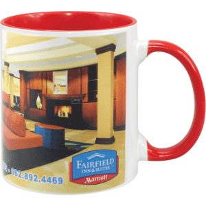 A two-tone sublimation mug featuring a red handle and interior, along with a detailed design and branding.