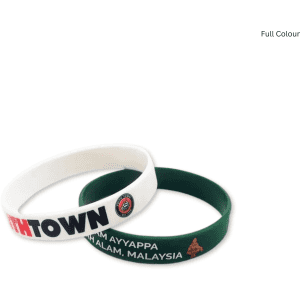 A pair of silicone wristbands, one white with branding and one green, featuring decorative elements.