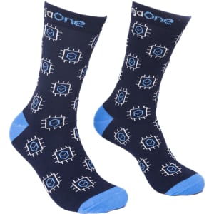 Crew Jacquard Socks in navy blue with light blue accents and geometric patterns. Features a logo on the cuff.