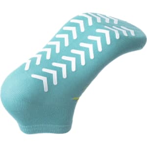 A pair of aqua blue custom short gripper socks with white non-slip grip patterns on the sole.