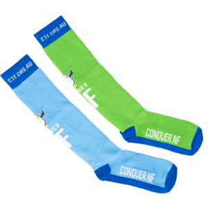 Knee high jacquard socks in blue and green, featuring a logo and text on the cuffs.