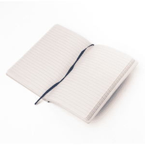 A soft smooth PU-covered notebook in light colour, featuring lined pages and a ribbon bookmark.
