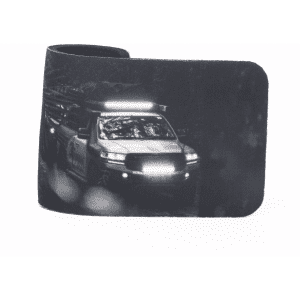 A stubby holder featuring a monochrome design of a vehicle, with a sleek black finish. It has a logo.