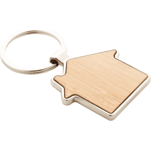 A house-shaped keyring made of bamboo with a silver metal ring, featuring a smooth, natural wood finish.