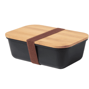 A black lunch box with a bamboo lid, secured with a brown elastic band. It has a simple, modern design.