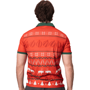 A festive orange polo shirt featuring a patterned design, including reindeer and Christmas motifs, with a green collar.