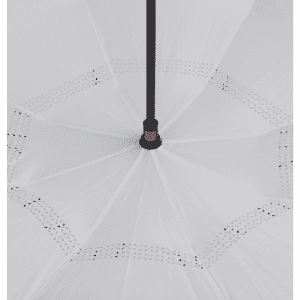 An inverted umbrella with a white canopy and a black handle features decorative edge detailing.