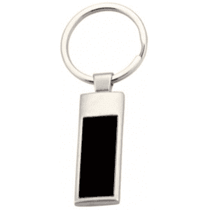 A silver keychain featuring a rectangular pendant with a black section. It has a circular metal ring.