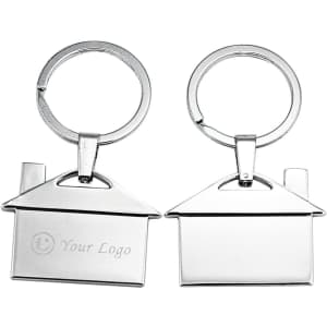 A silver keychain shaped like a house, featuring a blank side for engraving and a branded logo on the other side.