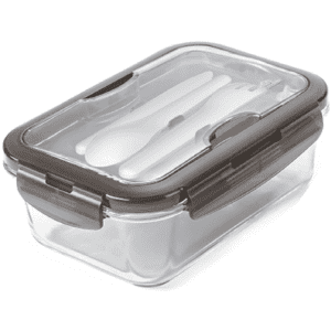 A clear lunch box with a grey lid, containing white utensils. Suitable for storing meals.