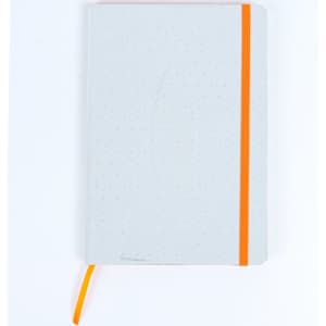 A light grey notebook with an orange elastic band and a matching ribbon bookmark. It features a subtle dotted pattern.