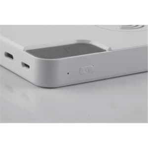 A white power bank with multiple ports and a power button. It features a sleek, minimalistic design.
