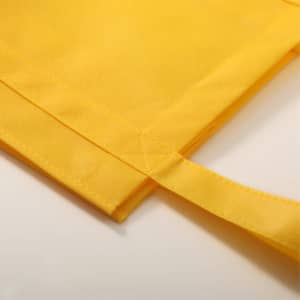A yellow tote bag featuring stitched seams and sturdy handles, designed for durability and style.