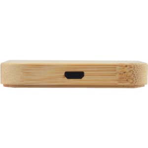 A bamboo wireless charger with a sleek, square design featuring a charging port on the side.