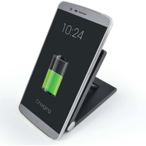 A wireless charger in black with a silver phone on it, displaying a charging battery icon.