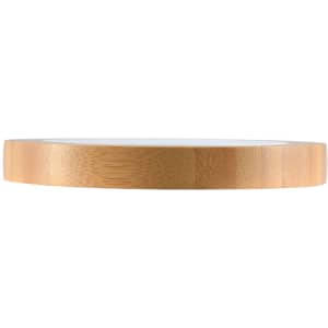 A bamboo wireless charger with a sleek, circular design and a smooth surface, featuring a natural wood finish.