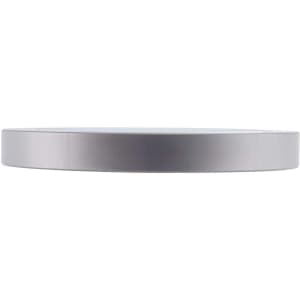 A sleek silver wireless charger with a minimalist design and a round shape. It features a logo on the surface.