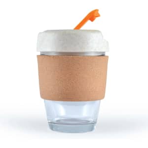 A reusable coffee cup with a cork band and an orange straw. The cup features a clear glass body and a light-colored lid.