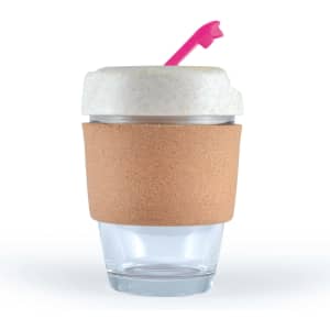 A reusable coffee cup with a cork band, clear base, and a white lid with a pink straw. It has a logo on it.