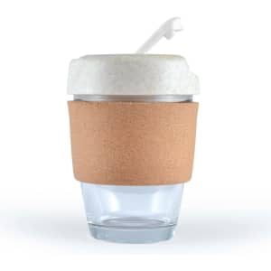 A reusable coffee cup featuring a transparent glass base and a white lid with a straw, encircled by a natural cork band.