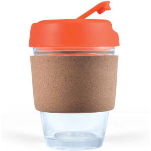 A reusable coffee cup featuring a clear body, an orange lid, and a cork band for insulation.
